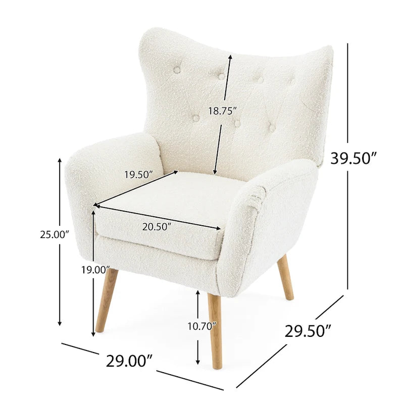 Poltrona club wingback trapuntata in bouclé con gambe in legno di hevea