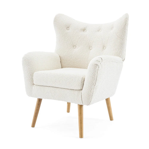 Sillón club capitoné con respaldo envolvente de bouclé y patas de madera de caucho